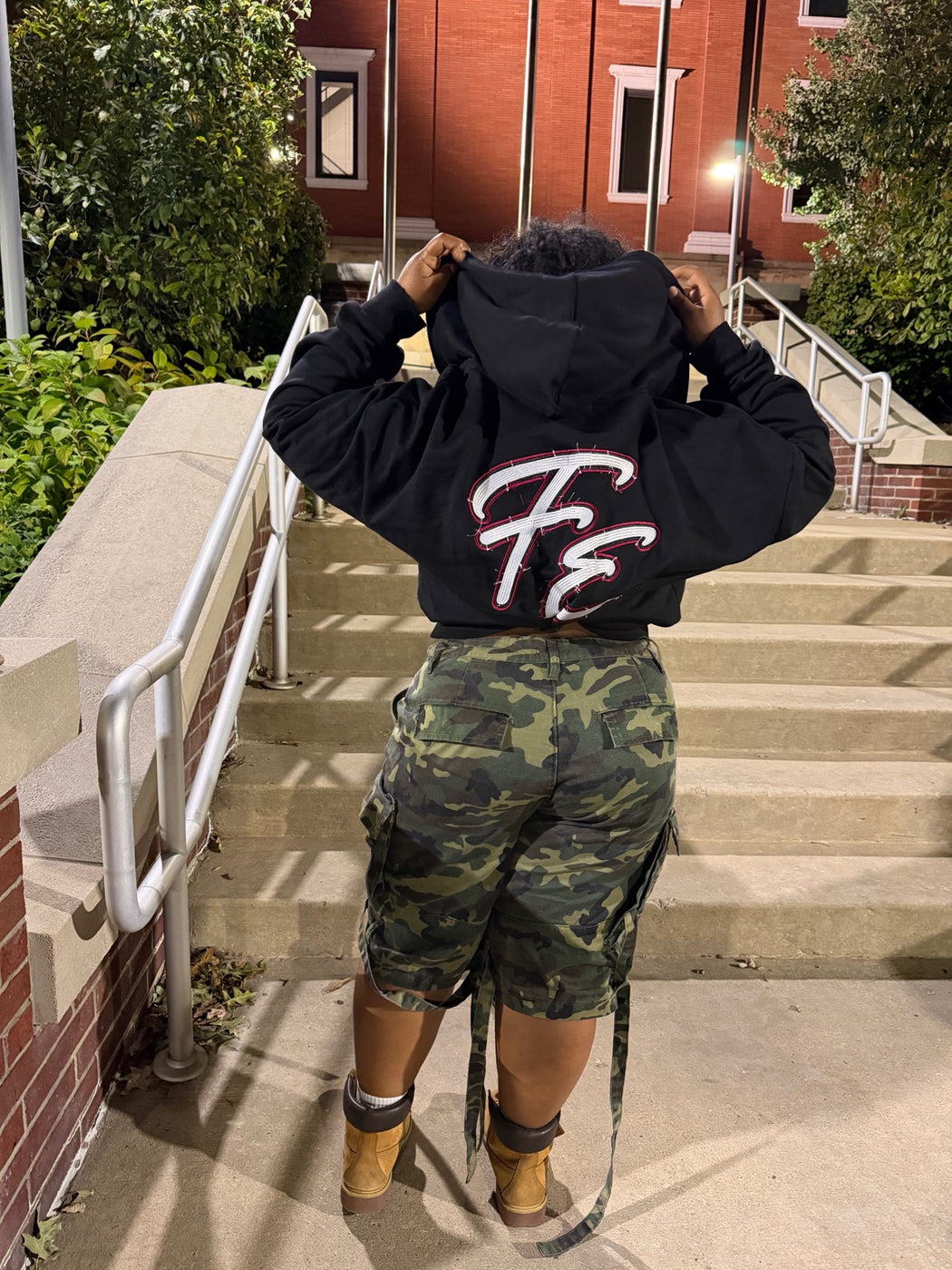 Back view of Forbidden Era hoodie showing embroidered style FE logo