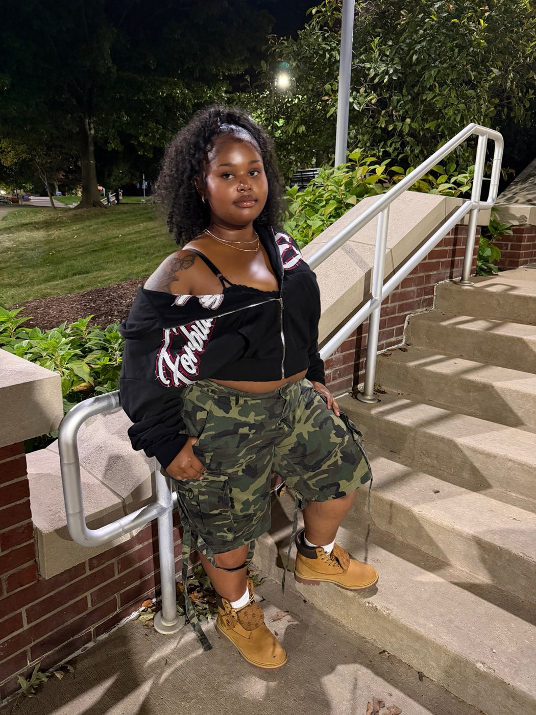 Forbidden Era Drop 02 hoodie shown in a nighttime side angle